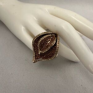 Gold tone leaf shaped ring with gold and topaz colored rhinestones